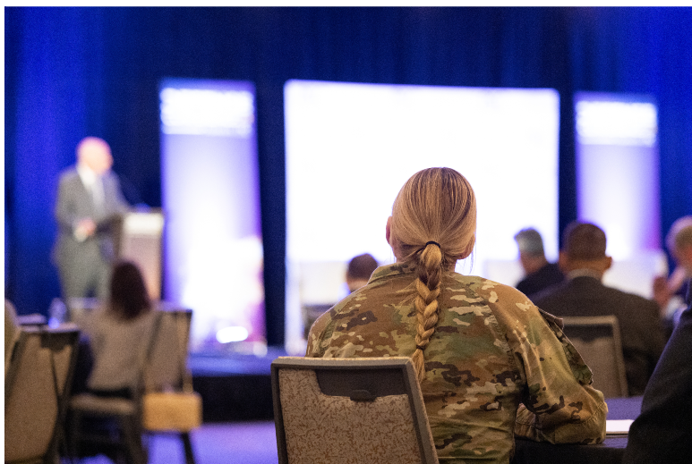 Military personnel at government tech event